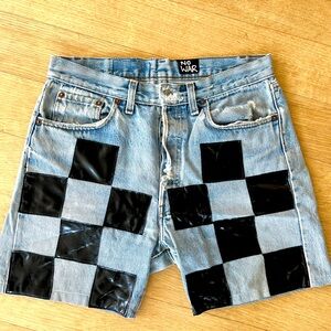 Vintage Levi’s 501 denim shorts w/patent leather checker board front.